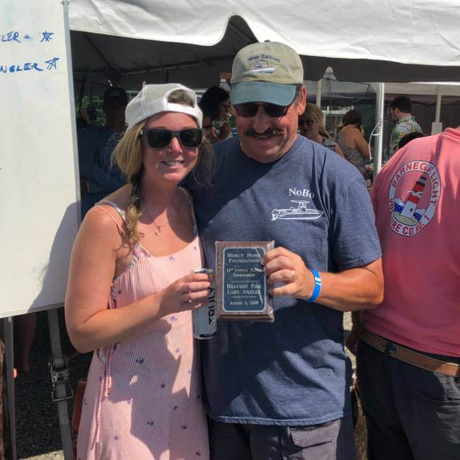 Amanda Nut accepting first place for largest fluke caught by a lady angler
